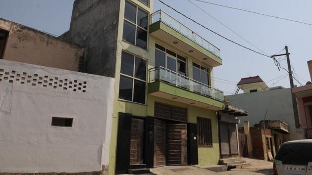 A view of the house Akash built for his family in Gurgaon’s Bamdoli Village. While neither Akash or his family speak openly about his experience in the observation home, Akash survived by befriending an older hitman and emerged seen as a leader. Several attempts at returning to education failed once schools learnt of his past, and slipping in and out of depression, Akash at 19, decided to form his own extortion gang. (Parveen Kumar / HT Photo) A view of the house Akash built for his family in Gurgaon’s Bamdoli Village. While neither Akash or his family speak openly about his experience in the observation home, Akash survived by befriending an older hitman and emerged seen as a leader. Several attempts at returning to education failed once schools learnt of his past, and slipping in and out of depression, Akash at 19, decided to form his own extortion gang. (Parveen Kumar / HT Photo)