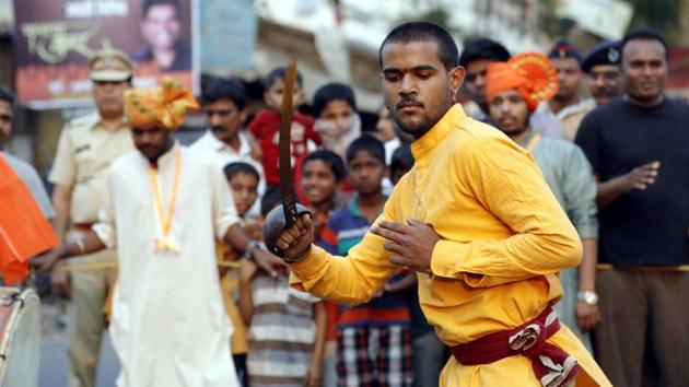 A man performing during the Shiv Jayanthi celebrations at Nana peth on Sunday. (rahul raut/ht photo) 