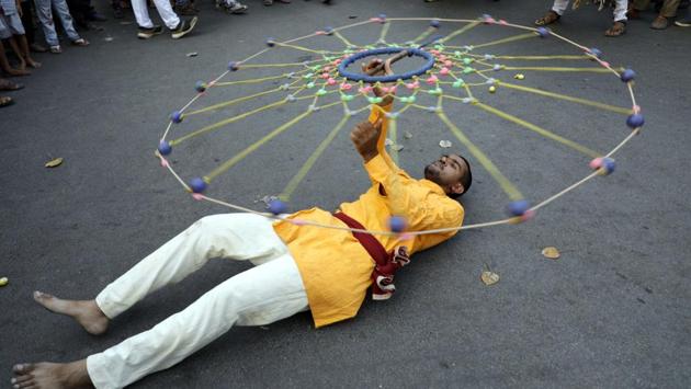 A man performing during the Shiv Jayanthi celebrations at Nana peth on Sunday. (rahul raut/ht photo) 