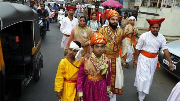 Residents take part in a rally dressed as family members of the Chhatrapati Shivaji Maharaj on the occasion of Shiv Jayanthi, celebrated according to the Marathi calendar, at Nana peth on Sunday. (Rahul raut/ht photo) 