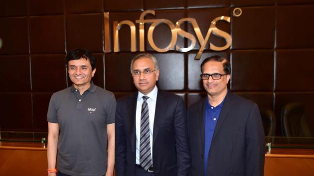 Infosys CEO Salil Parekh (C) with CFO Ranganath and CTO Pravin Rao (L) before a press conference in Bengaluru. (PTI File Photo) Infosys CEO Salil Parekh (C) with CFO Ranganath and CTO Pravin Rao (L) before a press conference in Bengaluru. (PTI File Photo)