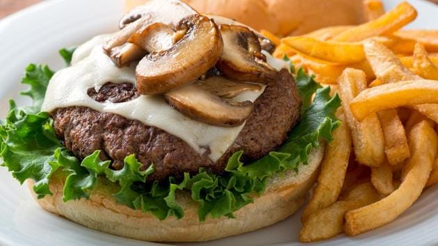 Researchers say if all hamburgers eaten in US could be made of a blend of 70% beef and 30% mushrooms, for instance, it would save as many emissions as taking 2.3 million cars off the road. (Getty Images/iStockphoto) Researchers say if all hamburgers eaten in US could be made of a blend of 70% beef and 30% mushrooms, for instance, it would save as many emissions as taking 2.3 million cars off the road. (Getty Images/iStockphoto)