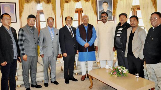 Nationalist Democratic Progressive Party leader Neiphiu Rio (4th from left) with BJP general secretary Ram Madhav and NDPP-BJP state officials pose with Governor of Nagaland PB Acharya at Raj Bhavan, in Kohima on Sunday. (PTI Photo) Nationalist Democratic Progressive Party leader Neiphiu Rio (4th from left) with BJP general secretary Ram Madhav and NDPP-BJP state officials pose with Governor of Nagaland PB Acharya at Raj Bhavan, in Kohima on Sunday. (PTI Photo)