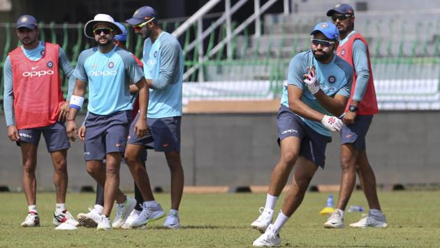 India captain Rohit Sharma, right, participates in a fielding practice session ahead of the tri-nation T20 cricket series in Colombo. (AP)