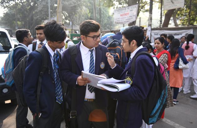 Students of Class 10 and Class 12 are seen doing their last minute revision, outside their examination centre (Sanchit Khanna/HT PHOTO) Students of Class 10 and Class 12 are seen doing their last minute revision, outside their examination centre (Sanchit Khanna/HT PHOTO)