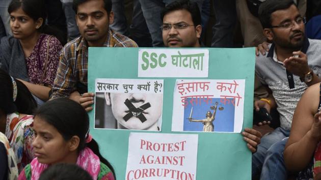 Staff Selection Commission candidates sit on a dharna in front of the office in protest against the examination paper leak in New Delhi on March 4. (Vipin Kumar/HT Photo) Staff Selection Commission candidates sit on a dharna in front of the office in protest against the examination paper leak in New Delhi on March 4. (Vipin Kumar/HT Photo)