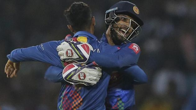 Sri Lanka captain Dinesh Chandimal, right, and bowler Danushka Gunathilaka celebrated the wicket of India's Shikhar Dhawan. (AP) Sri Lanka captain Dinesh Chandimal, right, and bowler Danushka Gunathilaka celebrated the wicket of India's Shikhar Dhawan. (AP)