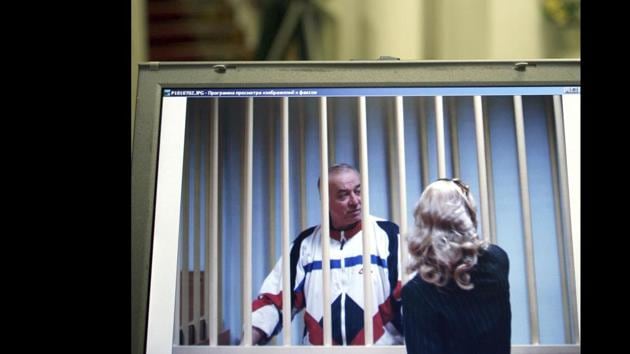 In this August 9, 2006 file photo, Sergei Skripal speaks to his lawyer from behind bars seen on a screen of a monitor outside a courtroom in Moscow.(AP)