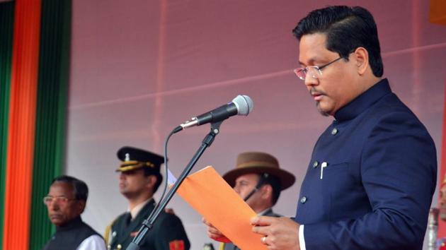 National People’s Party president Conrad Kongkal Sangma on Tuesday took oath as Meghalaya’s new chief minister with 11 other leaders to form the government in alliance with the BJP, three regional parties and an independent legislator in the northeastern state. (PTI) National People’s Party president Conrad Kongkal Sangma on Tuesday took oath as Meghalaya’s new chief minister with 11 other leaders to form the government in alliance with the BJP, three regional parties and an independent legislator in the northeastern state. (PTI)
