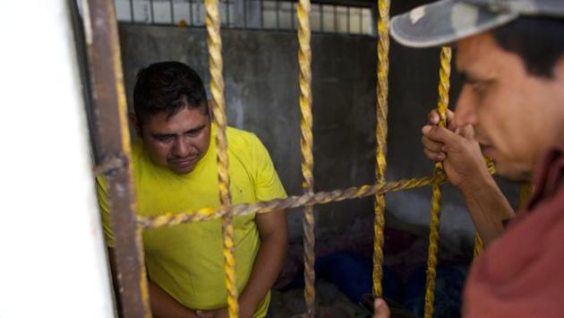A prisoner cries as he is interrogated about his alleged crimes of kidnapping and robbery. Having suffered from decades of violence by drug lords and cartels, these ‘Autodefensas’ have taken upon themselves to bring justice to the oppressed. On Tuesday, another vigilante group in Michoacan returned houses to the original and rightful owners of 35 families that criminals had taken over at gunpoint. (Rebecca Blackwell / AP)