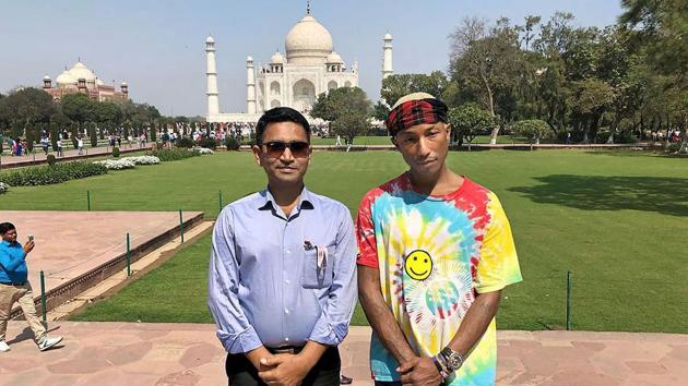 American musician Pharrell Williams poses in front of Taj Mahal in Agra on Tuesday. (PTI) American musician Pharrell Williams poses in front of Taj Mahal in Agra on Tuesday. (PTI)