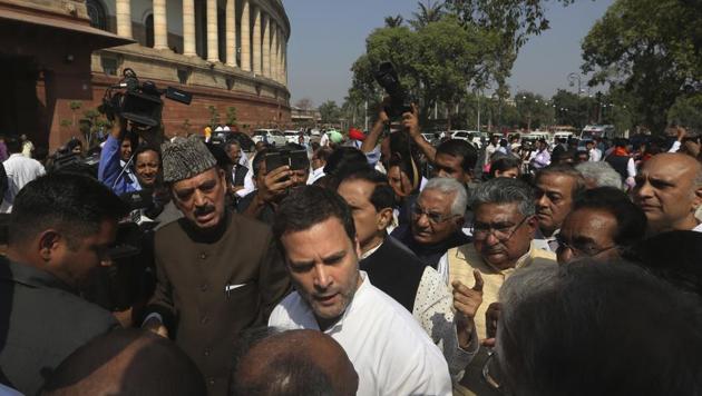 Congress president Rahul Gandhi, centre, talks to party leaders during a protest outside Parliament, in New Delhi on Tuesday.(AP)