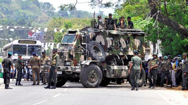 Sri Lankan army soldiers guard a road in Digana. More than two dozen arrests have been made so far following violence which claimed two lives. “We have decided to declare a state of emergency to ensure these clashes and tensions don’t spread elsewhere in the country,” said Dayasiri Jayasekera, a government spokesman. (REUTERS) Sri Lankan army soldiers guard a road in Digana. More than two dozen arrests have been made so far following violence which claimed two lives. “We have decided to declare a state of emergency to ensure these clashes and tensions don’t spread elsewhere in the country,” said Dayasiri Jayasekera, a government spokesman. (REUTERS)