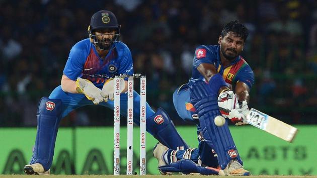 Sri Lanka's cricketer Kusal Perera (R) plays a shot as India's wicketkeeper Dinesh Karthik looks on during the opening Twenty20 international cricket match between of the Nidahas Trophy tri-nation Twenty20 tournament at the R Premadasa stadium in Colombo on Tuesday. (AFP) Sri Lanka's cricketer Kusal Perera (R) plays a shot as India's wicketkeeper Dinesh Karthik looks on during the opening Twenty20 international cricket match between of the Nidahas Trophy tri-nation Twenty20 tournament at the R Premadasa stadium in Colombo on Tuesday. (AFP)