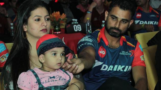 Mohammed Shami with his wife Hasin Jahan and daughter Aaira Shami at a Delhi Daredevils party in New Delhi on April 13, 2017. Shami’s wife has charged her husband with torture and having extra-marital affairs.(Hindustan Times/Shivam Saxena)