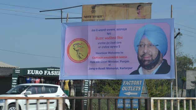 Hoardings of Punjab chief minister Capt Amarinder Singh on Amristar-Jalandhar national highway near Kartarpur on Tuesday.(HT Photo)