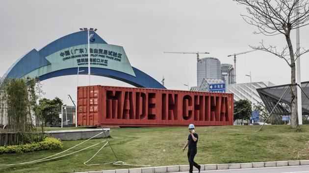A man walks past a sign reading "Made In China" at the China Guangdong Pilot Free Trade Zone in Shenzhen, Guangdong province, China. (Qilai Shen/Bloomberg) A man walks past a sign reading "Made In China" at the China Guangdong Pilot Free Trade Zone in Shenzhen, Guangdong province, China. (Qilai Shen/Bloomberg)