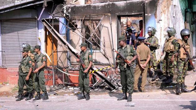 Sri Lanka's Special Task Force and Police officers stand guard near a burnt house after clashes in Digana. Sri Lankan President Maithripala Sirisena declared a state of emergency for a limited period of 10 days in the country by bringing into force Section 2 of the Public Security Ordinance, the president’s media division said. (REUTERS) Sri Lanka's Special Task Force and Police officers stand guard near a burnt house after clashes in Digana. Sri Lankan President Maithripala Sirisena declared a state of emergency for a limited period of 10 days in the country by bringing into force Section 2 of the Public Security Ordinance, the president’s media division said. (REUTERS)