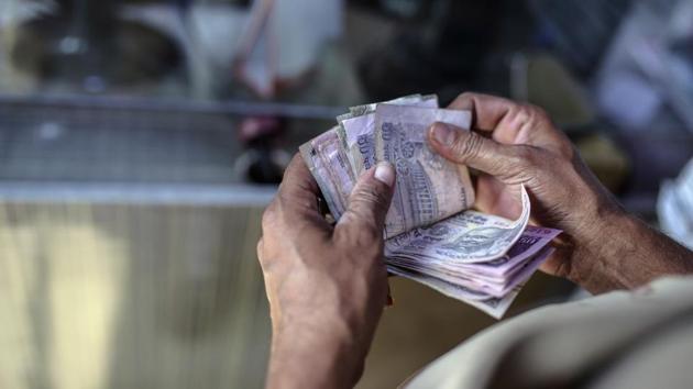 The rupee had gained 16 paise to close at 64.96 on steady unwinding of dollars by exporters and corporates on Tuesday. (Dhiraj Singh/Bloomberg)