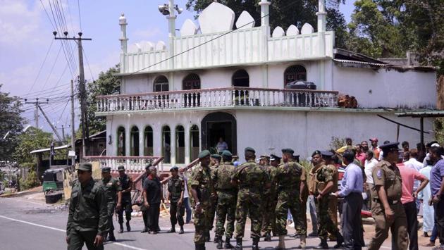 Sri Lankan army and police stand near a vandalized mosque in Digana, Kandy. A nationwide emergency was imposed on Tuesday after mob attacks against the Muslim population, in violence that has highlighted the country’s fragility as it recovers from decades of civil war. Tension brewed between ethnic groups over the past year, with Buddhist groups accusing Muslims of propagating forced conversion. (Pradeep Pathiran / AP) Sri Lankan army and police stand near a vandalized mosque in Digana, Kandy. A nationwide emergency was imposed on Tuesday after mob attacks against the Muslim population, in violence that has highlighted the country’s fragility as it recovers from decades of civil war. Tension brewed between ethnic groups over the past year, with Buddhist groups accusing Muslims of propagating forced conversion. (Pradeep Pathiran / AP)