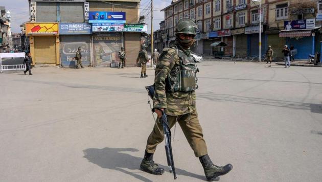 Security personnel guard a street during curfew-like restrictions imposed by the authorities to maintain law and order on Monday.(PTI File Photo)