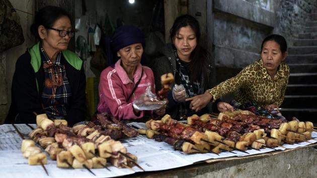 And with the women of the Northeast traditionally not constrained by domesticity, their presence in running such shops and marketplaces and shaping the local economy and culture makes them distinct from  their counterparts in the rest of the country. (Samir Jana / HT Photo) 