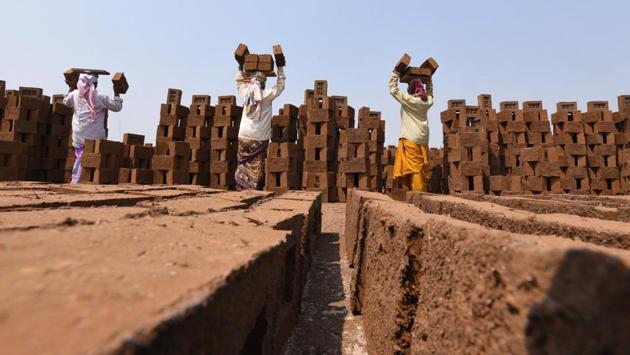 As the brick industry is one of the unorganised industries in India, women workers do not get the status which the men enjoy. (Pratham Gokhale/HT Photo) 