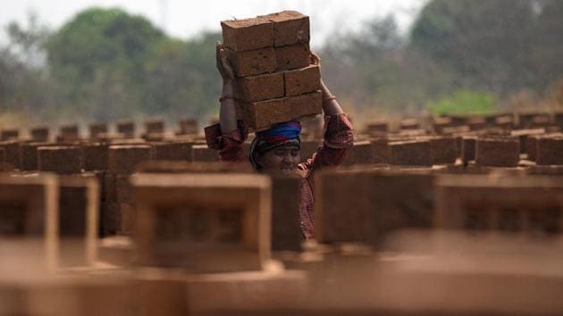 According to the Centre for Science and Environment (CSE), at least 10 million people work in kilns even as there are no official figures for the number of people employed to cut, shape and bake clay-fired bricks, mostly by hand, in tens of thousands of brick kilns in India. (Pratham Gokhale/HT Photo) 
