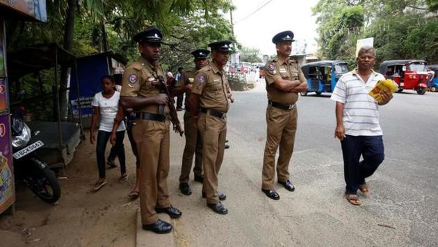 Sri Lanka's police officers stand guard on a main road after a clash between two communities in Digana, central district of Kandy, Sri Lanka, on March 7, 2018. (Reuters/Stringer) Sri Lanka's police officers stand guard on a main road after a clash between two communities in Digana, central district of Kandy, Sri Lanka, on March 7, 2018. (Reuters/Stringer)