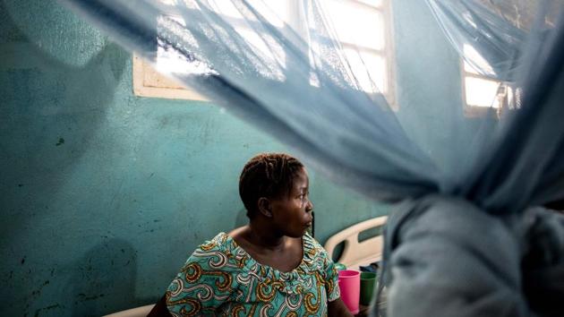 Denise Borive, 31 recovers from an emergency caesarian at a hospital in Bunia. After hearing about an inevitable attack on her village, nine-month pregnant Borive fled on foot with her mother and children. The Bigo medical centre is struggling with the human influx. The facility has treated 1,900 displaced people since February 9, including 450 pregnant women, 20 of whom have given birth. (John Wessels / AFP) Denise Borive, 31 recovers from an emergency caesarian at a hospital in Bunia. After hearing about an inevitable attack on her village, nine-month pregnant Borive fled on foot with her mother and children. The Bigo medical centre is struggling with the human influx. The facility has treated 1,900 displaced people since February 9, including 450 pregnant women, 20 of whom have given birth. (John Wessels / AFP)