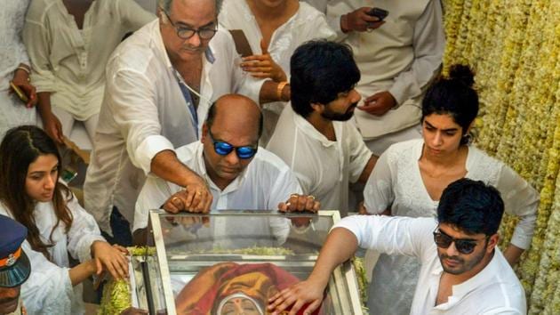 Mumbai: Boney Kapoor with his daughter Khushi seen on the truck carrying mortal remains of Sridevi during the funeral procession in Mumbai. (PTI) Mumbai: Boney Kapoor with his daughter Khushi seen on the truck carrying mortal remains of Sridevi during the funeral procession in Mumbai. (PTI)