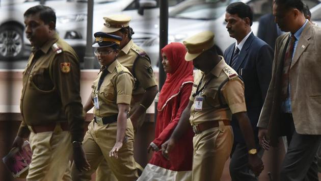 The Supreme Court on Thursday upheld the marriage of Hadiya (C), a 26-year-old Kerala woman who converted to Islam, to Shafin Jahan, overturning a high court order that annulled the marriage as sham. Pronouncing the landmark decision that upholds a woman’s right to choose her partner, the court said, “Hadiya is at liberty to pursue her life and NIA will carry on investigation as per law.” (Vipin Kumar / HT File) 