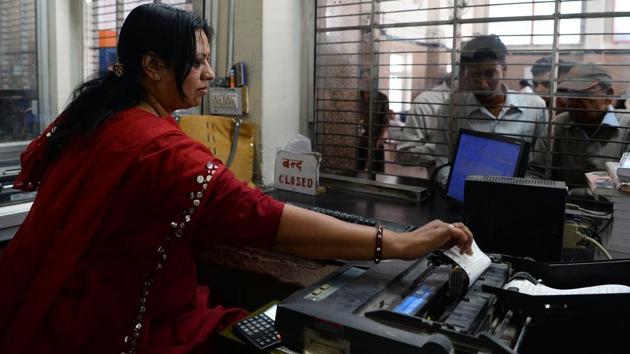 A staffer prints tickets for passengers at the booking counter. Roughly 7,000 passengers travelling through this major junction come into direct contact with these women managing a major state-run institution from the ground up. While urban subway networks in major Indian cities may have train carriages designated for women, the move is less about empowerment, rather a measure to prevent sexual harassment. (Sajjad Hussain / AFP)