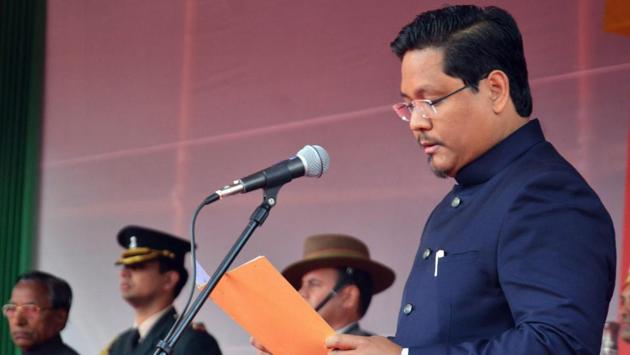 National People's Party (NPP) president Conrad K Sangma takes oath as Meghalaya chief minister during a swearing-in ceremony in Shillong on Tuesday.(PTI Photo)