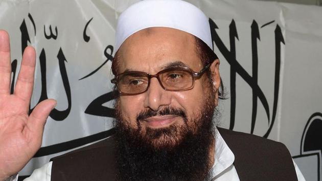 Hafiz Saeed gestures as he arrives for a press conference in Lahore on June 26, 2014.(AFP File Photo)