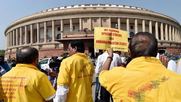 TDP MPs protest in front of Mahatma Gandhi's statue at Parliament House demanding special status for Andhra Pradesh during the second phase of the budget session in New Delhi, on March 8.(PTI Photo)