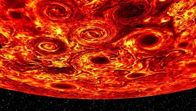 This handout picture provided by Nature shows Jupiter's South Pole in a mosaic of images acquired by the Jovian InfraRed Auroral Mapper at wavelengths. Jupiter's tempestuous, gassy atmosphere stretches some 3,000 kilometres (1,860 miles) deep and comprises a hundredth of the planet's mass, studies based on observations by NASA's Juno spacecraft revealed on March 7, 2018.(AFP)