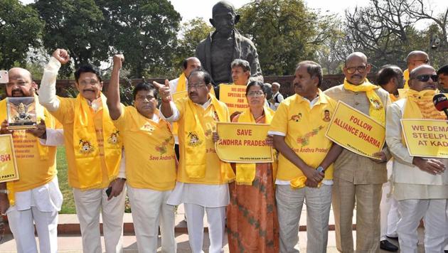 TDP MPs protest in front of Mahatma Gandhi's statue in Parliament in New Delhi on Thursday . (PTI) TDP MPs protest in front of Mahatma Gandhi's statue in Parliament in New Delhi on Thursday . (PTI)