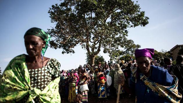 Internally Displaced Congolese wait inside a Internally Displaced Persons (IDP) Camp for a distribution of clothes in Bunia. Most of those displaced are living with host families. About 2,000 are holed up in tents around the regional hospital -- six toilets and four showers are currently available for them, and more are being built. (John Wessels / AFP) Internally Displaced Congolese wait inside a Internally Displaced Persons (IDP) Camp for a distribution of clothes in Bunia. Most of those displaced are living with host families. About 2,000 are holed up in tents around the regional hospital -- six toilets and four showers are currently available for them, and more are being built. (John Wessels / AFP)