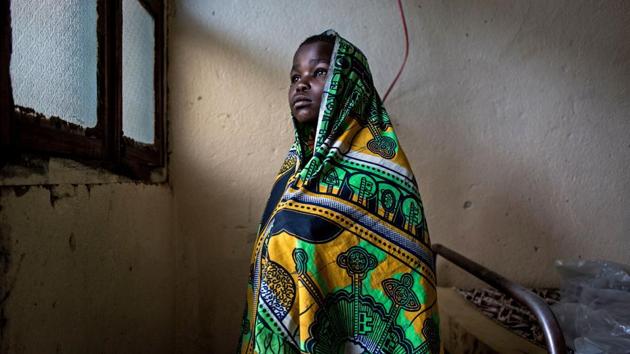Paulette Buye, 12, was struck in the neck by a machete. Buye, her mother and brother, who suffered machete lacerations to the leg, hid in bushes for three nights before reaching Bunia. Doctors without Borders (MSF) last week said that in the previous month, around 40,000 people had fled across Lake Albert to neighbouring Uganda and 20,000 to Bunia, the capital of Ituri. (John Wessels / AFP) Paulette Buye, 12, was struck in the neck by a machete. Buye, her mother and brother, who suffered machete lacerations to the leg, hid in bushes for three nights before reaching Bunia. Doctors without Borders (MSF) last week said that in the previous month, around 40,000 people had fled across Lake Albert to neighbouring Uganda and 20,000 to Bunia, the capital of Ituri. (John Wessels / AFP)