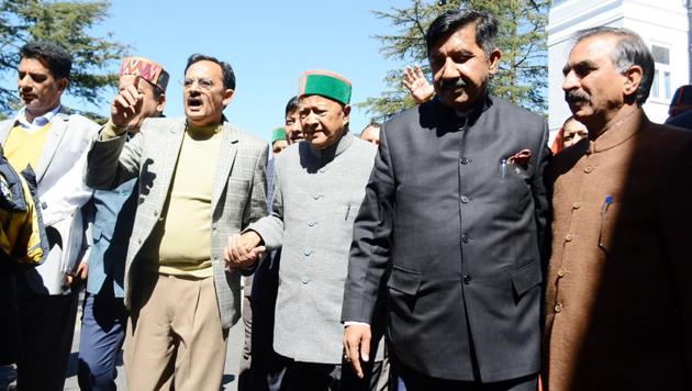 Senior Congress leader Virbhadra Singh with party MLAs staging a walkout at Vidhan Sabha in Shimla on Wednesday. (Deepak Sansta/HT) Senior Congress leader Virbhadra Singh with party MLAs staging a walkout at Vidhan Sabha in Shimla on Wednesday. (Deepak Sansta/HT)