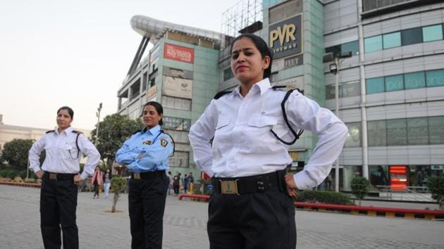 Women bouncers and security personnel at a city mall. These women ensure guests safely exit the building and get a cab home after a night of fun. (Parveen Kumar/HT Photo) Women bouncers and security personnel at a city mall. These women ensure guests safely exit the building and get a cab home after a night of fun. (Parveen Kumar/HT Photo)