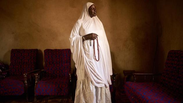 Houssa Nientao, 64, one of the few female marabouts, poses for a photo in Bamako. (Michele Cattani / AFP) 
