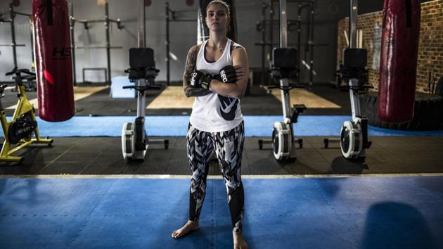 Shana Power, 25, a mixed martial artist (MMA), poses for a picture in the gym which she co-owns called Power House Intensive Training (PHIT), in Johannesburg. “When I was growing up I was very athletic, I’ve always been sporty. So I understood that the mind was as important as the body... if you can unlock the mind and build the mind then your body will be an unstoppable force,” said Power. (Gulshan Khan / AFP) 