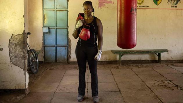 Sarah Achieng, a 31 year-old professional boxer and sports administrator poses for photographs after her training session at Kariobangi social hall gym in Nairobi. (Patricia Esteve / AFP) 