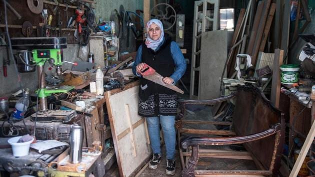 Asmaa Megahed a 31-year-old Egyptian carpenter poses for a picture at her workshop in Abdeen district in downtown Cairo. (Khaled dESOUKI / AFP) 
