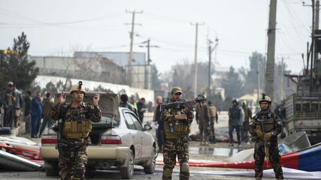 Afghan security personnel arrive at a site after a car bomb targeted foreign troops in Kabul on March 2.(AFP file photo)