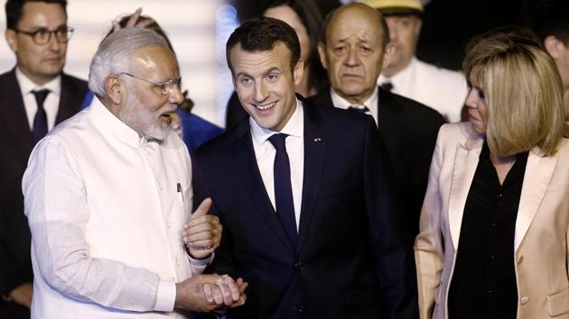 French president Emmanuel Macron shakes hands with Prime Minister Narendra Modi as his wife Brigitte Macron looks on after arriving at Air Force Station Palam in New Delhi, on March 9, 2018. (Reuters) French president Emmanuel Macron shakes hands with Prime Minister Narendra Modi as his wife Brigitte Macron looks on after arriving at Air Force Station Palam in New Delhi, on March 9, 2018. (Reuters)