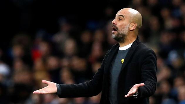 Manchester City manager Pep Guardiola sporting the yellow ribbon on his chest during Premier League match.(Action Images via Reuters)