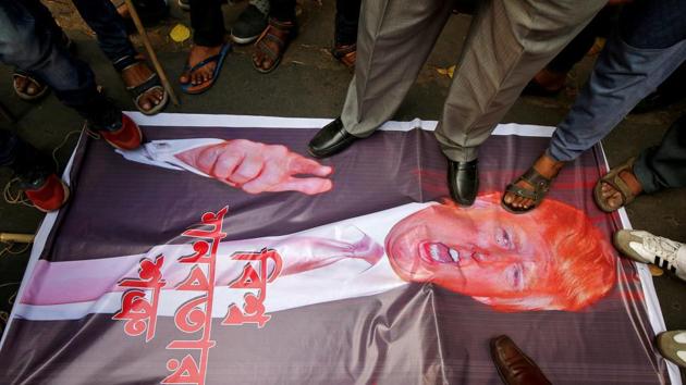 People step on a poster of US President Donald Trump during a protest against the bombing of civilians in Syria, outside the US consulate in Kolkata on March 5, 2018. (Rupak De Chowdhuri / REUTERS) People step on a poster of US President Donald Trump during a protest against the bombing of civilians in Syria, outside the US consulate in Kolkata on March 5, 2018. (Rupak De Chowdhuri / REUTERS)